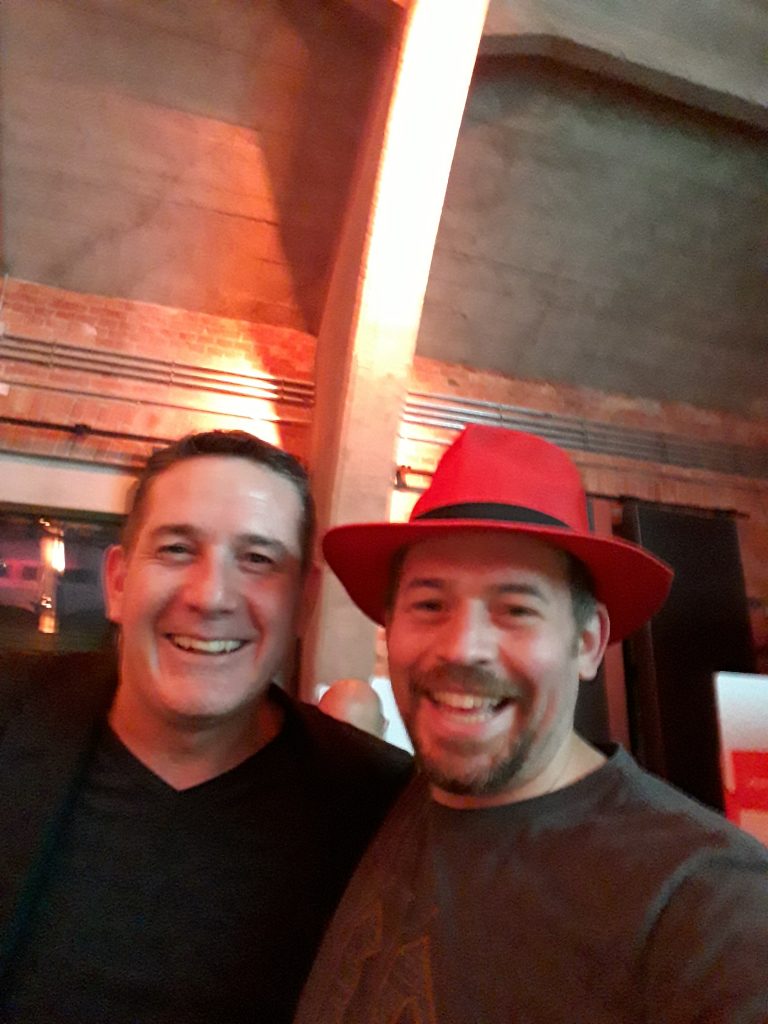 Jon Spriggs and Tim White. Jon wears a Red Hat.